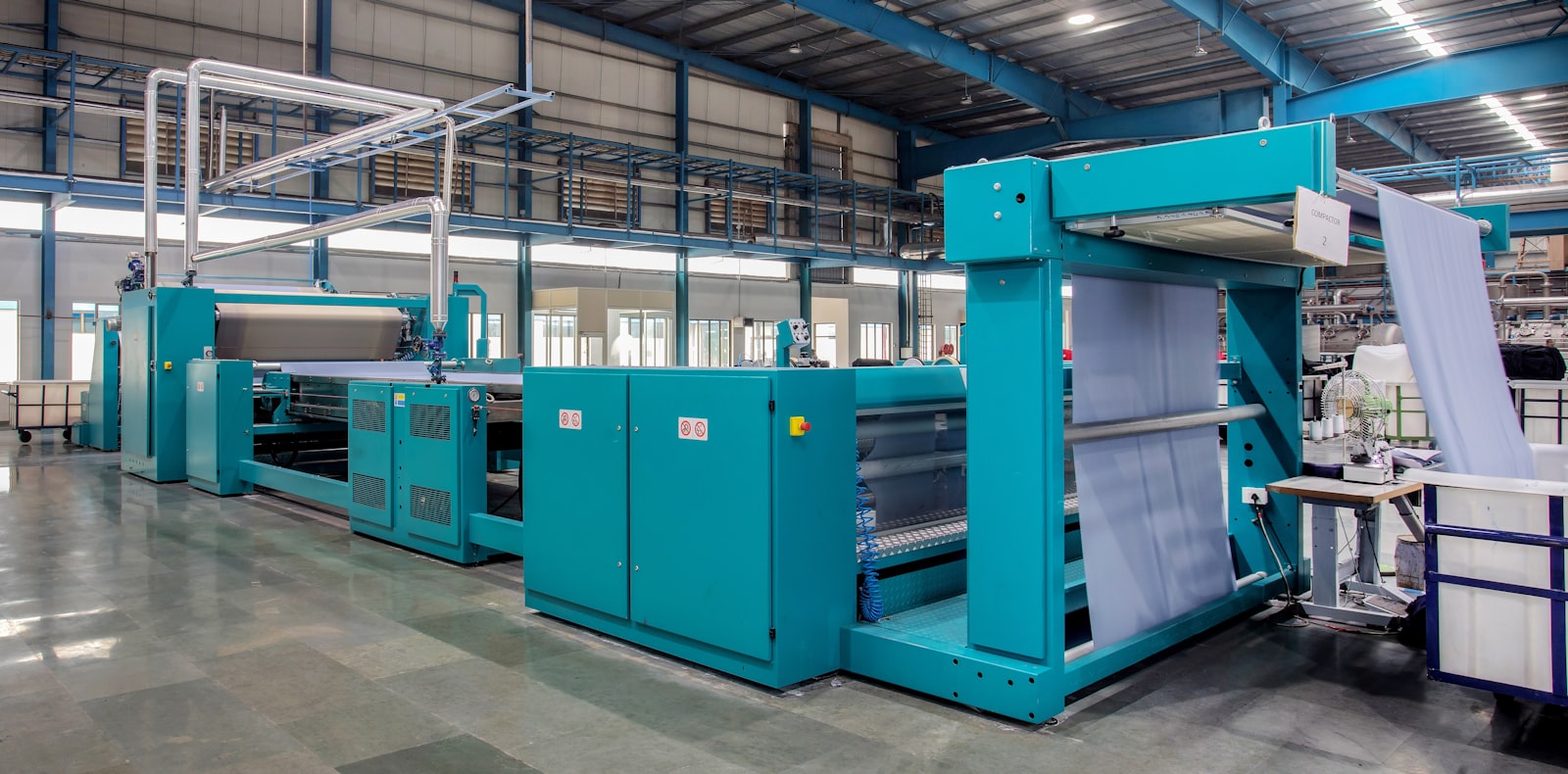 Industrial knit production machinery on a factory floor